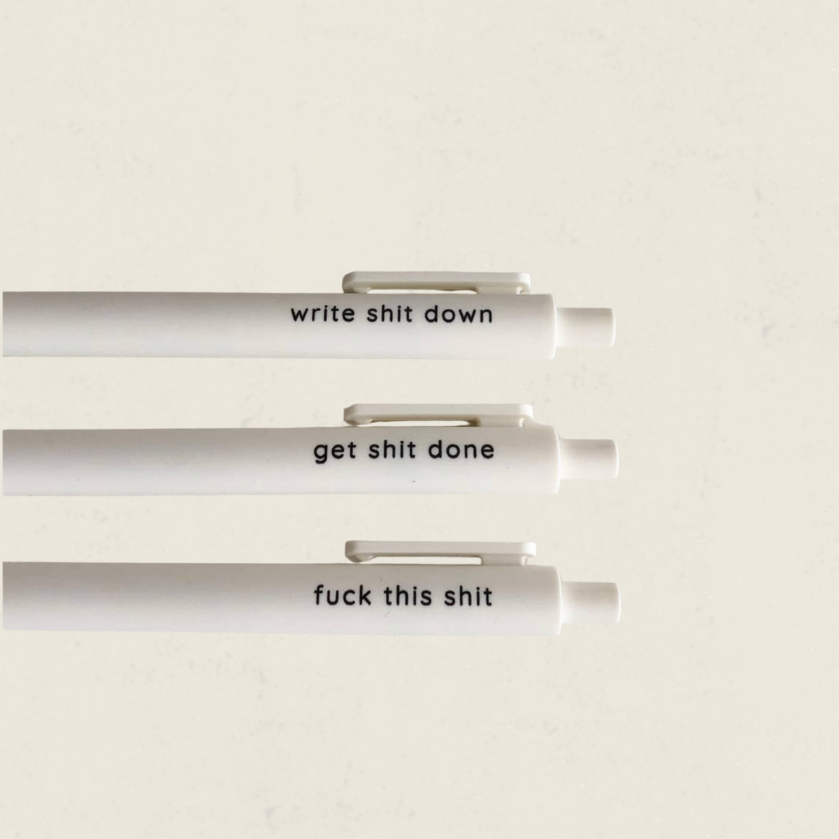 Ensemble de trois stylos gel blancs avec messages humoristiques write shit down et get shit done, boutique Sans Filtre