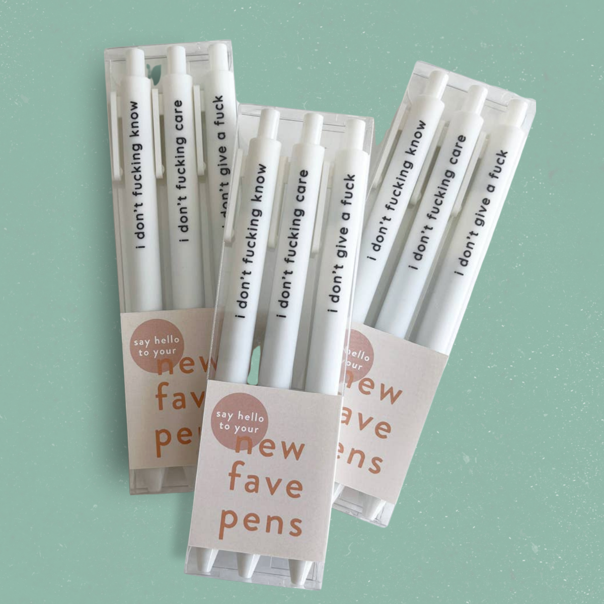 Trois ensembles de stylos gel blancs i don't give a fuck dans leur emballage New Fave Pens, boutique Sans Filtre